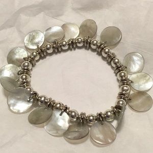 Silver tone stretch bracelet with Albalone shells. Very beautiful. Lightweight